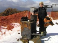 Deborah Boon at what's left of the oven, after the fire burnt the lodge to the ground